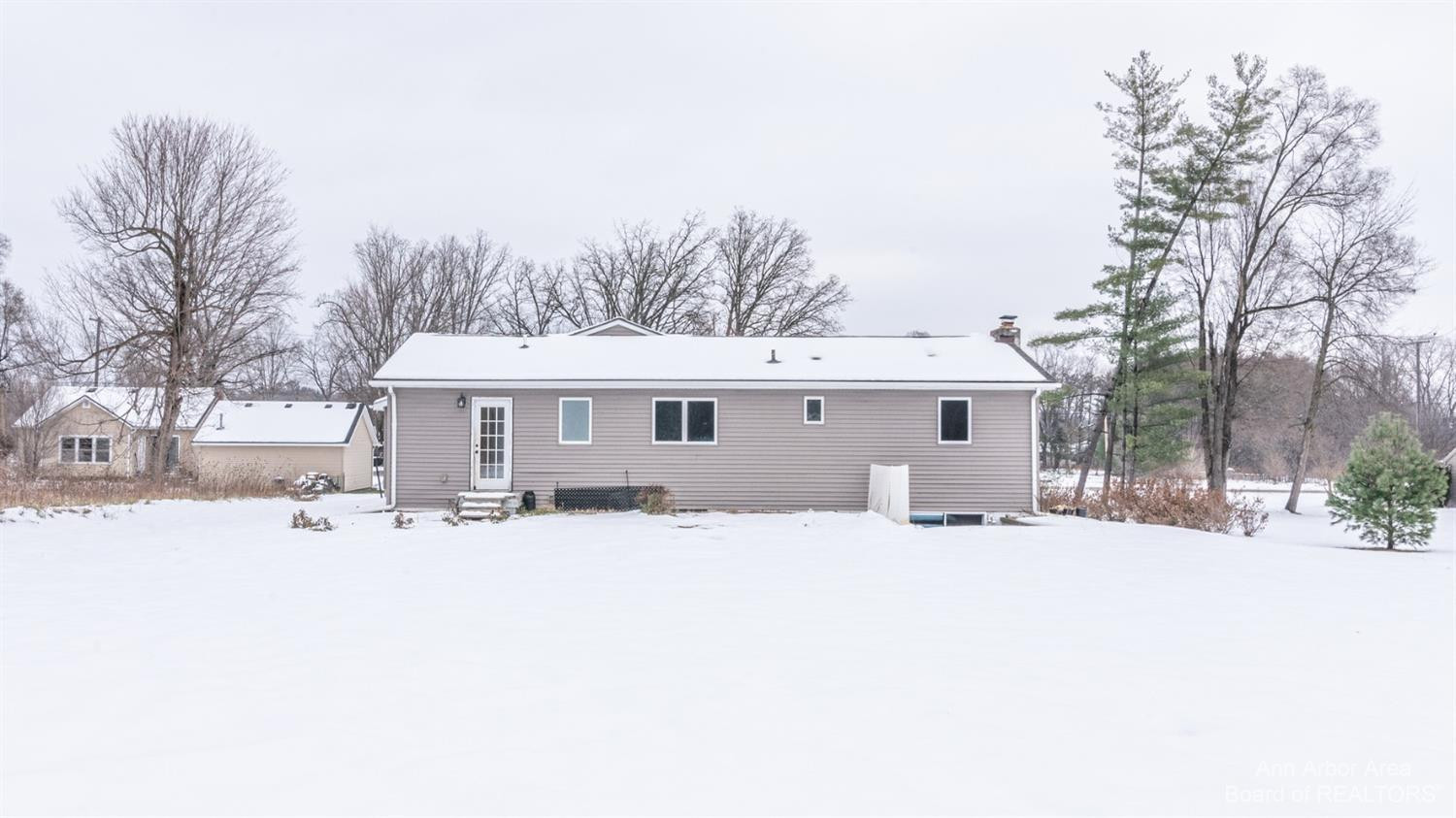 4711 Dexter-Pinckney Road Dexter, MI 48130 - Photo 25 of 30 Back of home with 10 x 12 patio