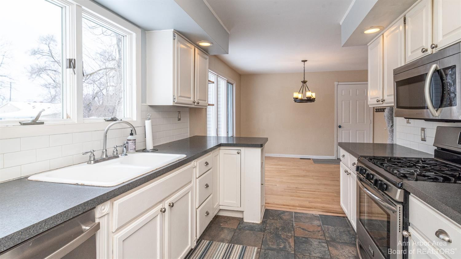 4711 Dexter-Pinckney Road Dexter, MI 48130 - Photo 7 of 30 Bright galley kitchen with tile floor