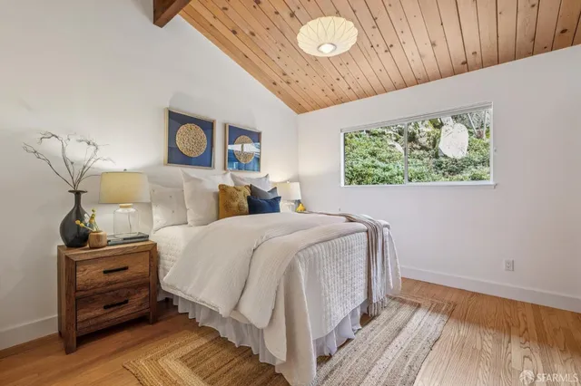 a view of a house with a garage and balcony