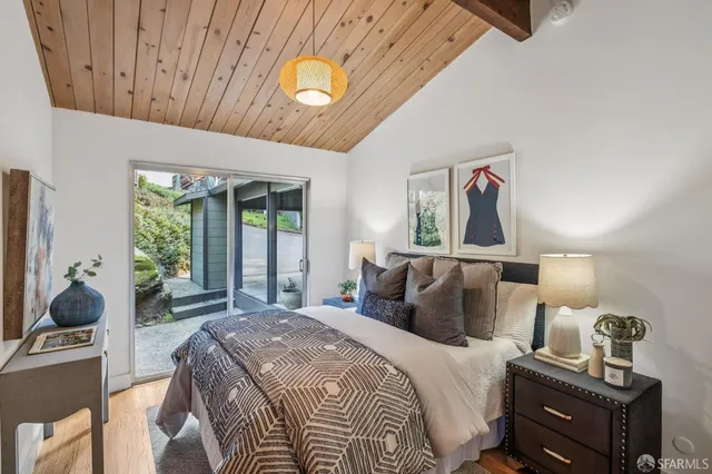 a view of a forest with mountains in the background