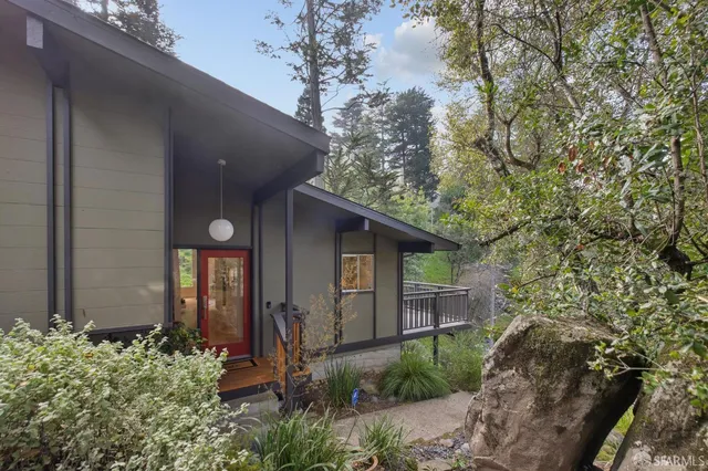 a view of balcony with floor to ceiling window and wooden floor