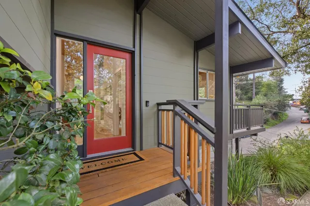 a view of a patio with couches table and chairs and potted plants
