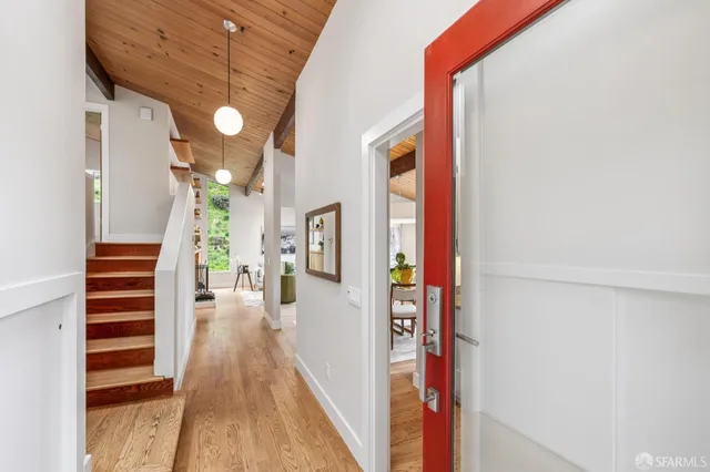 a living room with furniture a fireplace and a table