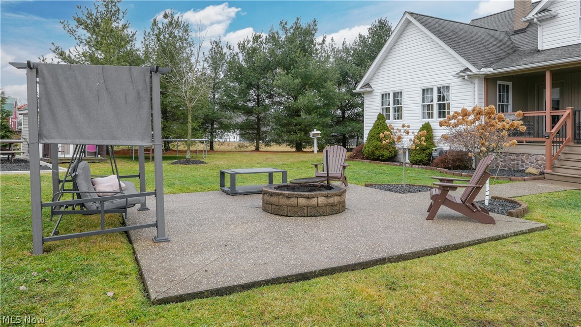 9561 Creaser Road North Bloomfield, OH 44450 - Photo 29 of 45 View of patio / terrace featuring an outdoor fire pit