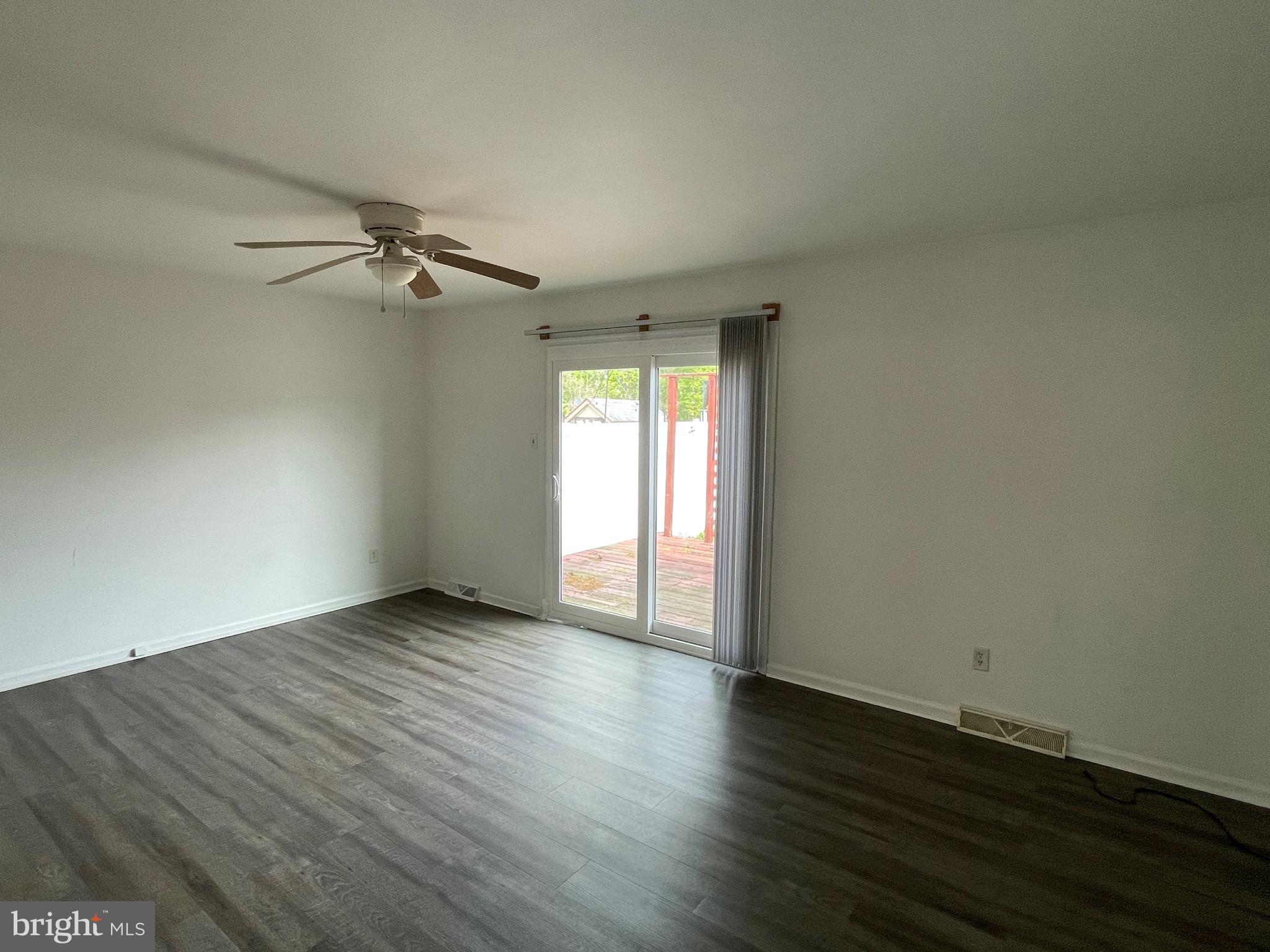 3314 Roxbury Road Hatfield, PA 19440 - Photo 12 of 26 a view of an empty room with a window and wooden floor