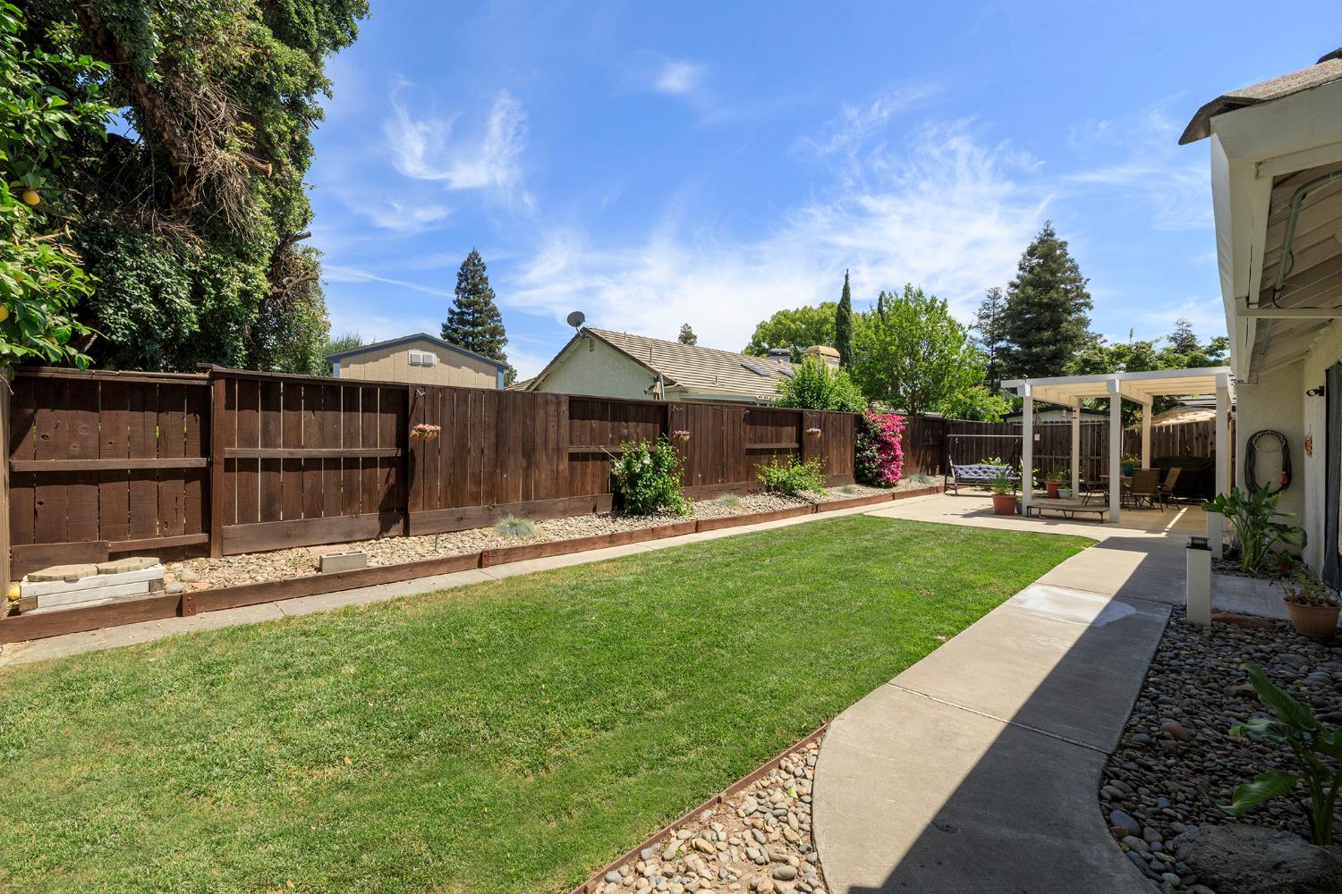 230 Meyenberg Avenue Ripon, CA 95366 - Photo 50 of 52 a front view of house with yard and outdoor seating