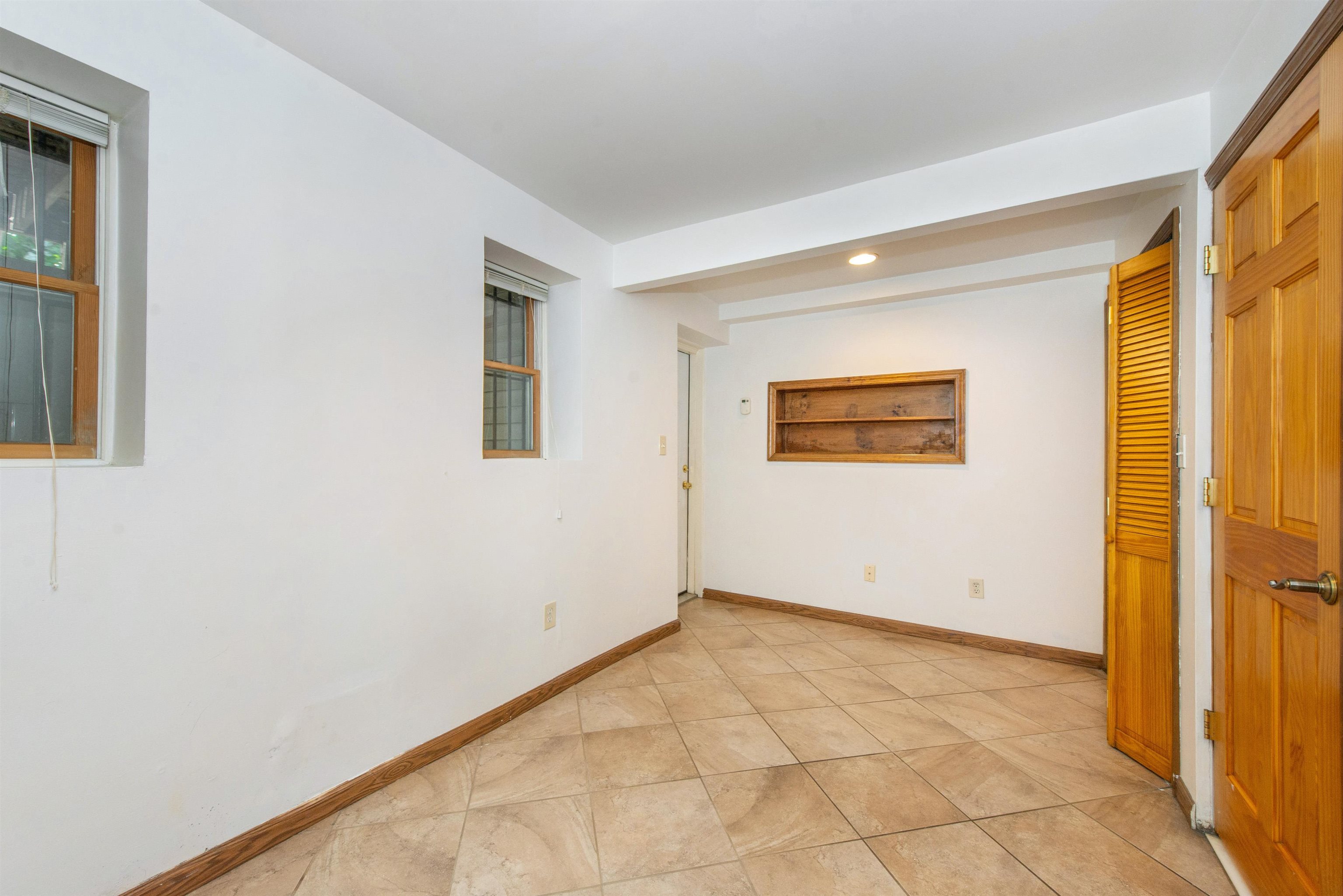 45 Monitor Street, Unit 1 Jersey City, NJ 07304 - Photo 11 of 14 an empty room with a window