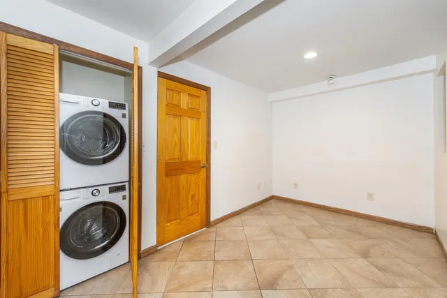 a view of a hallway with washer and dryer