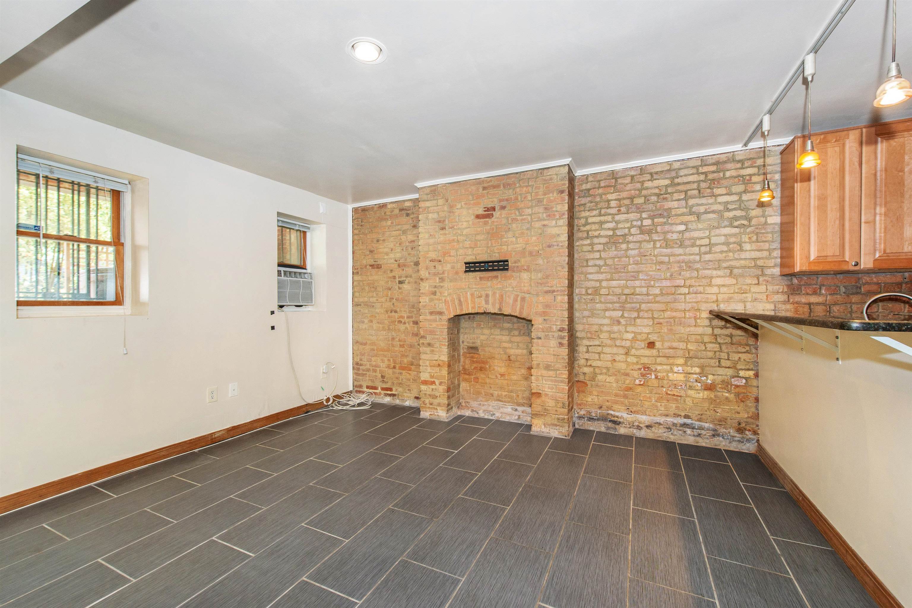 45 Monitor Street, Unit 1 Jersey City, NJ 07304 - Photo 4 of 14 a view of empty room with windows