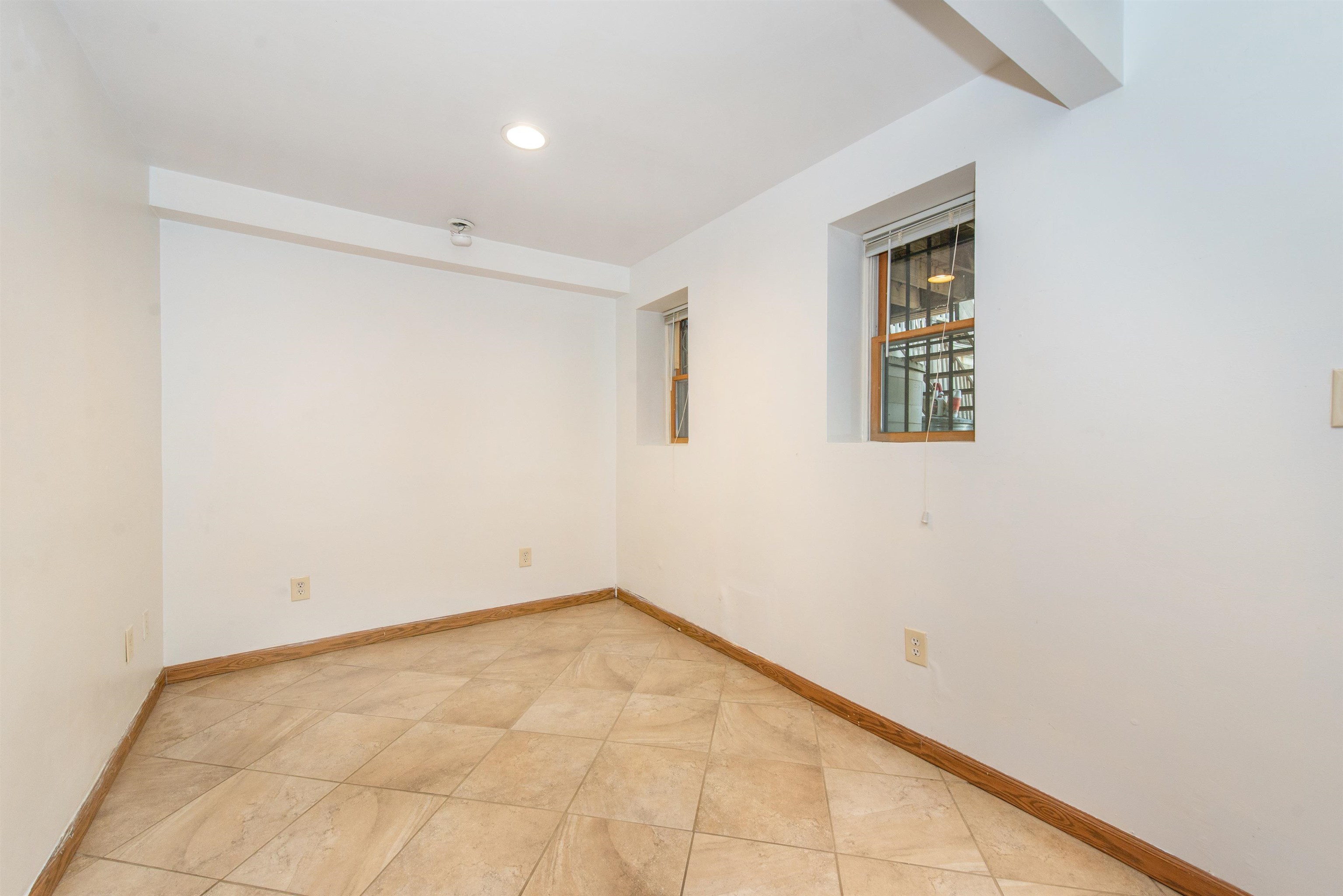 45 Monitor Street, Unit 1 Jersey City, NJ 07304 - Photo 10 of 14 an empty room with windows