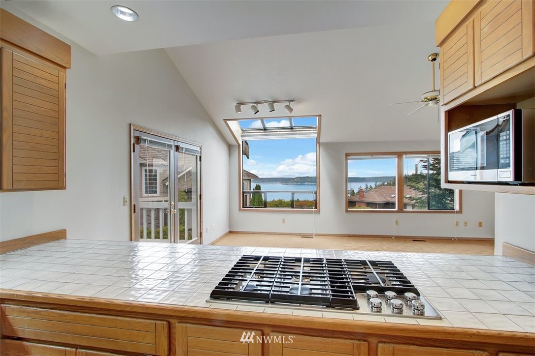 6720 139th Place Southwest Edmonds, WA 98026 - Photo 11 of 27 a view of a livingroom with wooden floor and windows