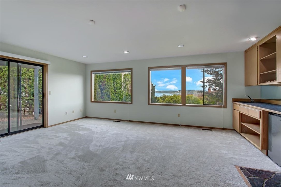 6720 139th Place Southwest Edmonds, WA 98026 - Photo 16 of 27 an empty room with windows and fireplace