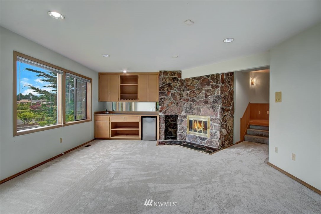 6720 139th Place Southwest Edmonds, WA 98026 - Photo 17 of 27 a living room with furniture and a fireplace