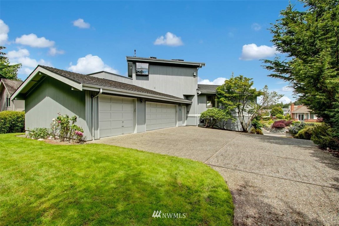 6720 139th Place Southwest Edmonds, WA 98026 - Photo 4 of 27 a front view of a house with a yard and garage