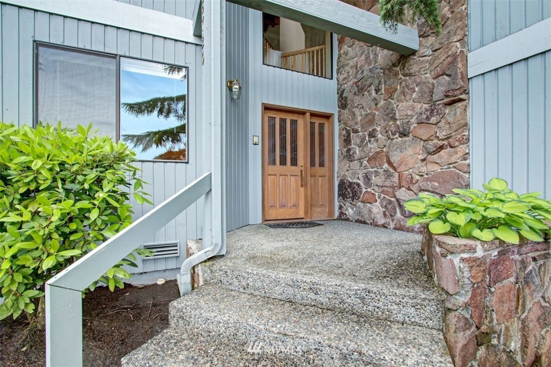 6720 139th Place Southwest Edmonds, WA 98026 - Photo 6 of 27 a house with a potted plant on the outside side
