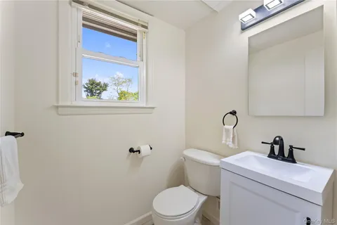 a bathroom with a toilet and a sink