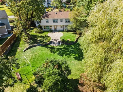 a view of house with yard