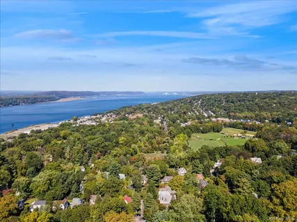 an aerial view of a houses with a yard