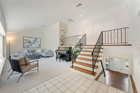 a view of entryway dining room and hall with wooden floor