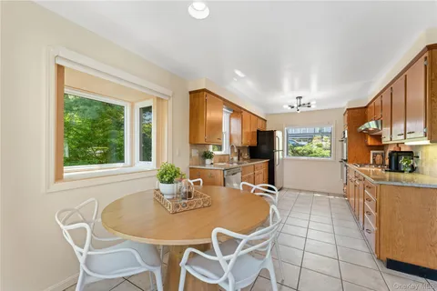 a dining room with furniture and window