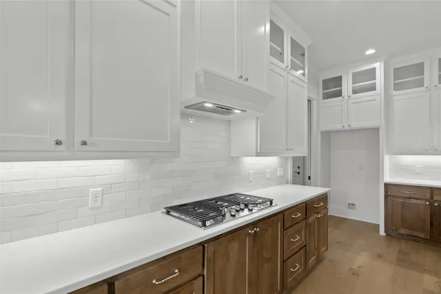 a kitchen with a stove and a refrigerator