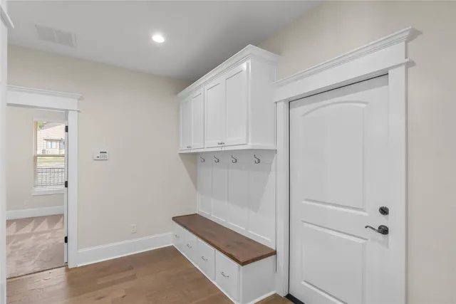 a view of a livingroom with a ceiling fan and window