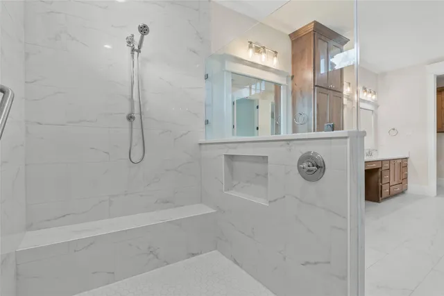 a bathroom with a bathtub and a shower