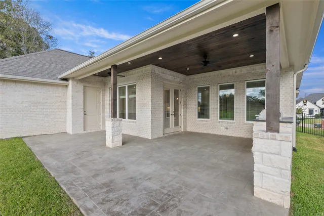 a view of a field with a tree in the background