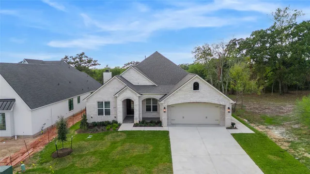 an aerial view of a house with a garden
