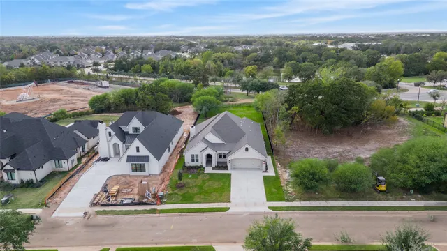 an aerial view of houses with outdoor space