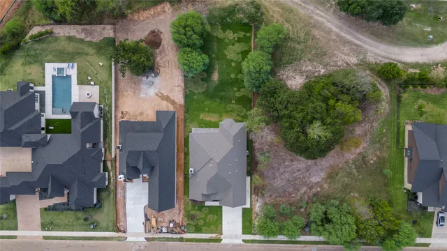 an aerial view of a house with a garden