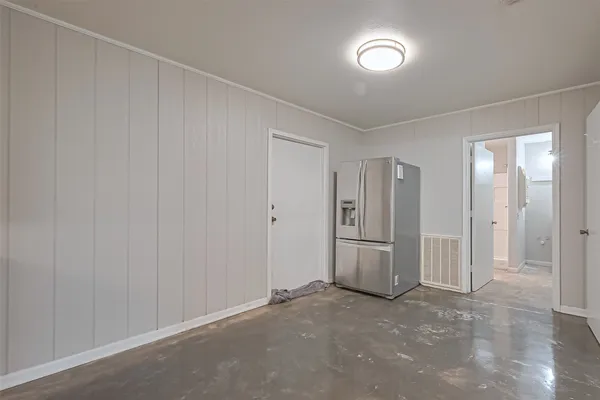 a kitchen with cabinets appliances and a counter top space