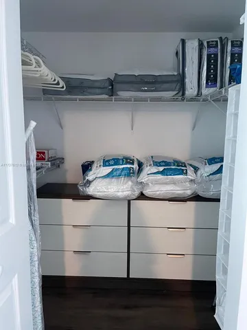 a kitchen with a stove and cabinets