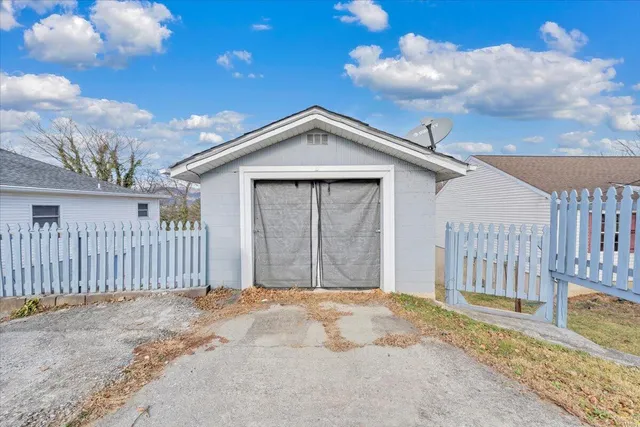 a view of a house with a backyard