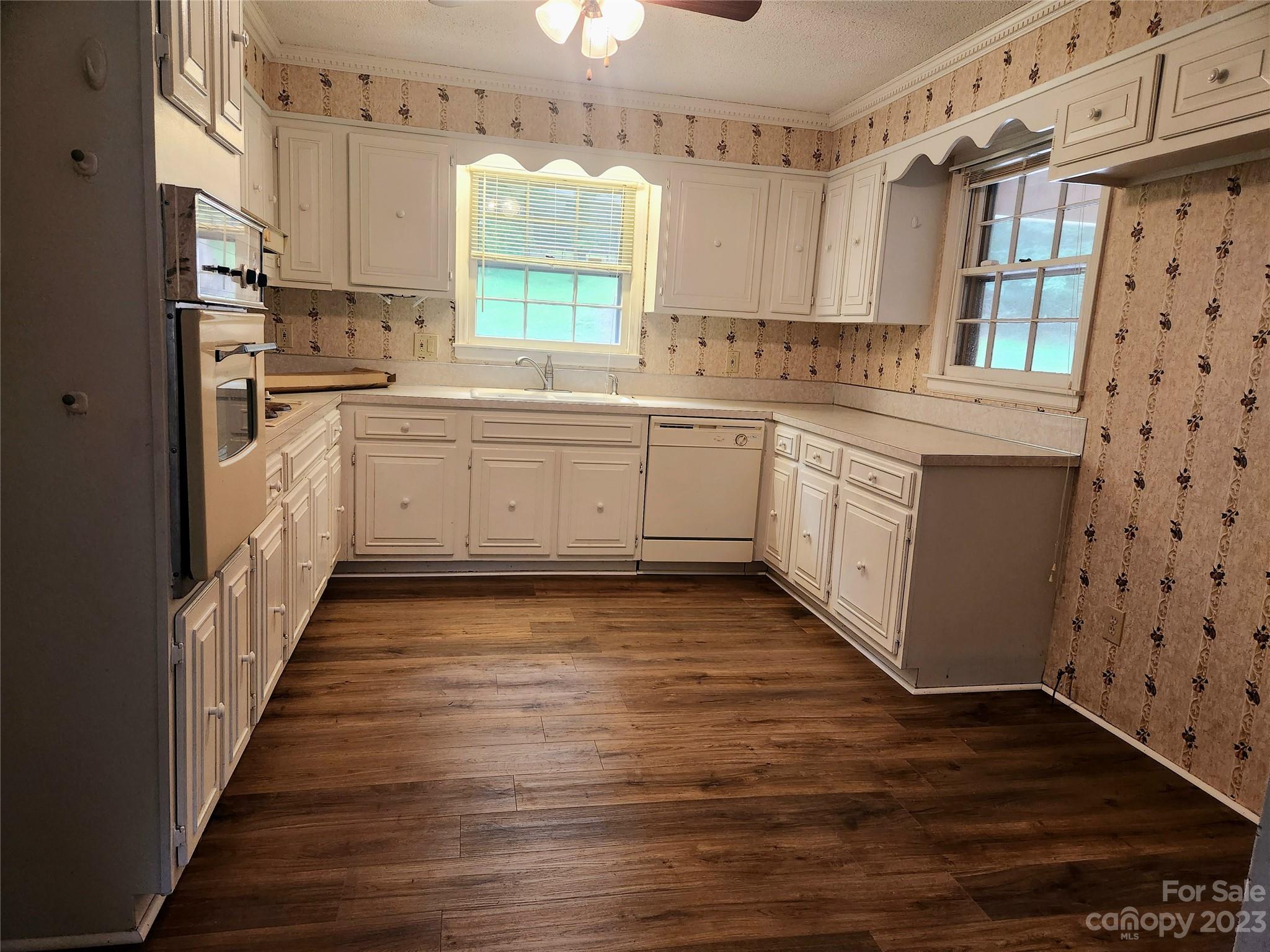 128 Devine Street Stanley, NC 28164 - Photo 12 of 36 a kitchen with sink cabinets and window