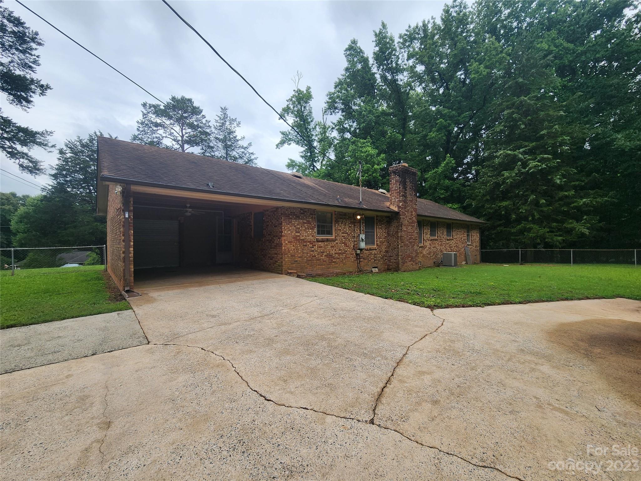 128 Devine Street Stanley, NC 28164 - Photo 14 of 36 a front view of house with garage and yard