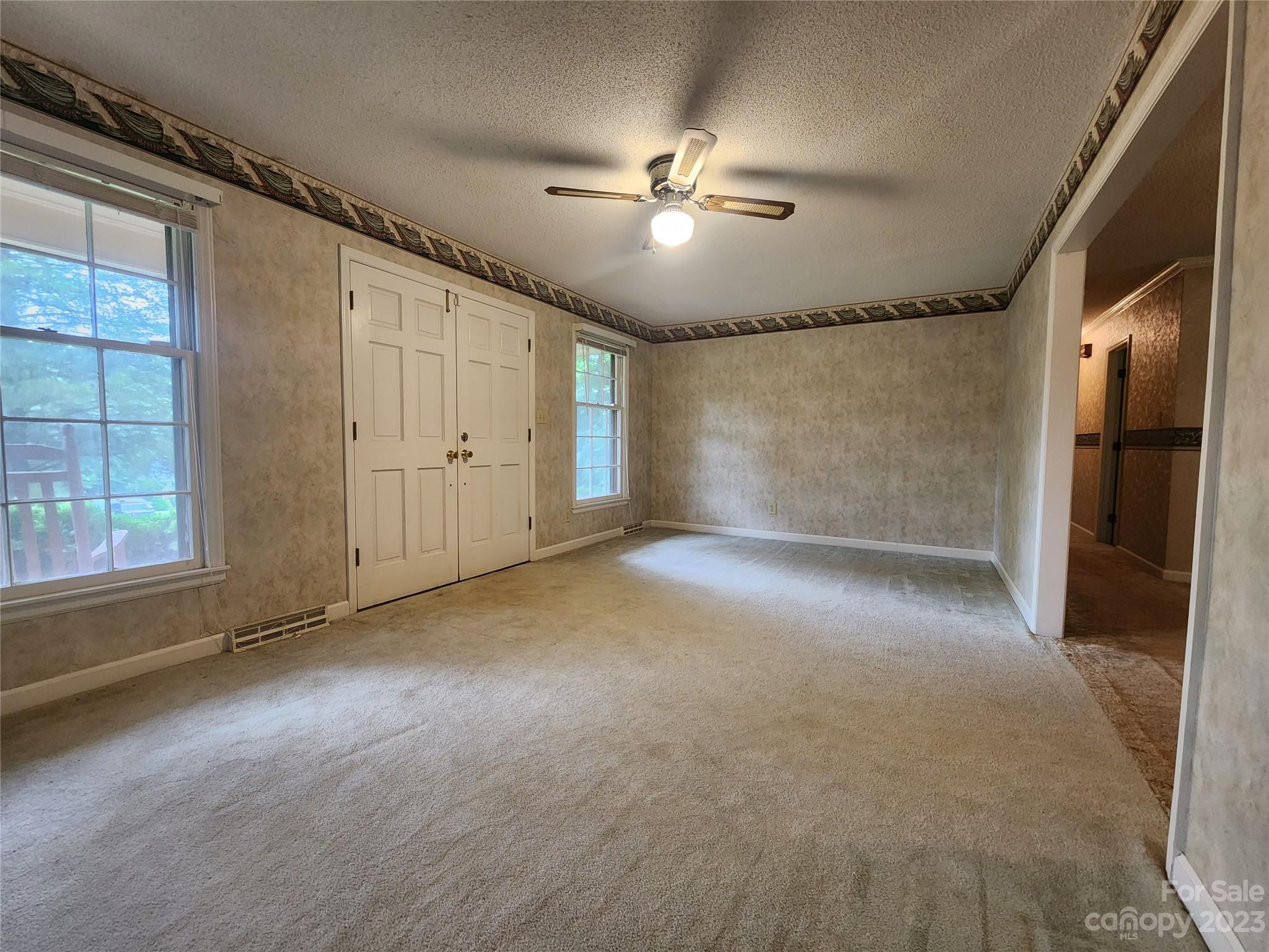 128 Devine Street Stanley, NC 28164 - Photo 24 of 36 a view of an empty room with a window