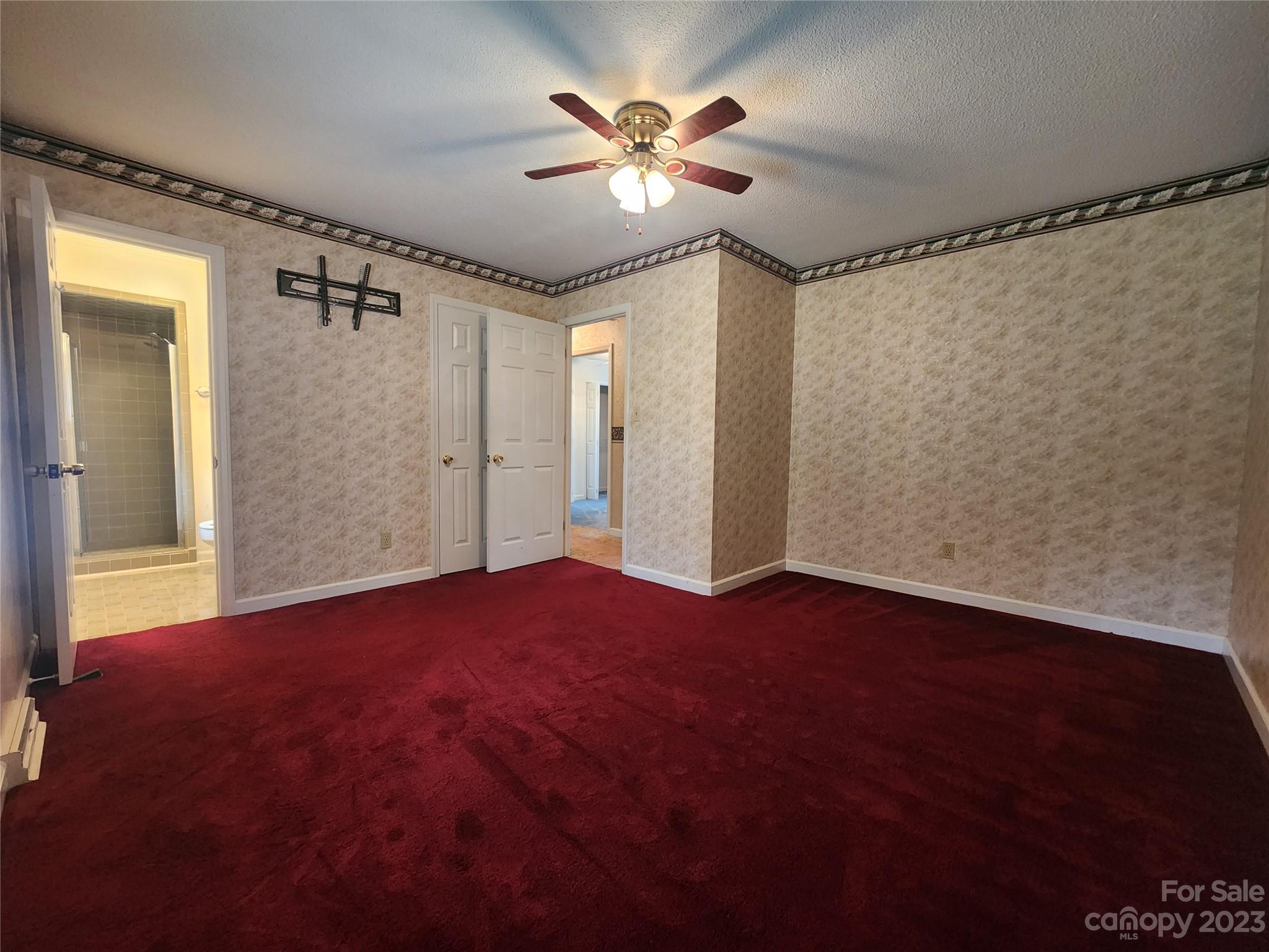 128 Devine Street Stanley, NC 28164 - Photo 29 of 36 a view of empty room with a ceiling fan and a window