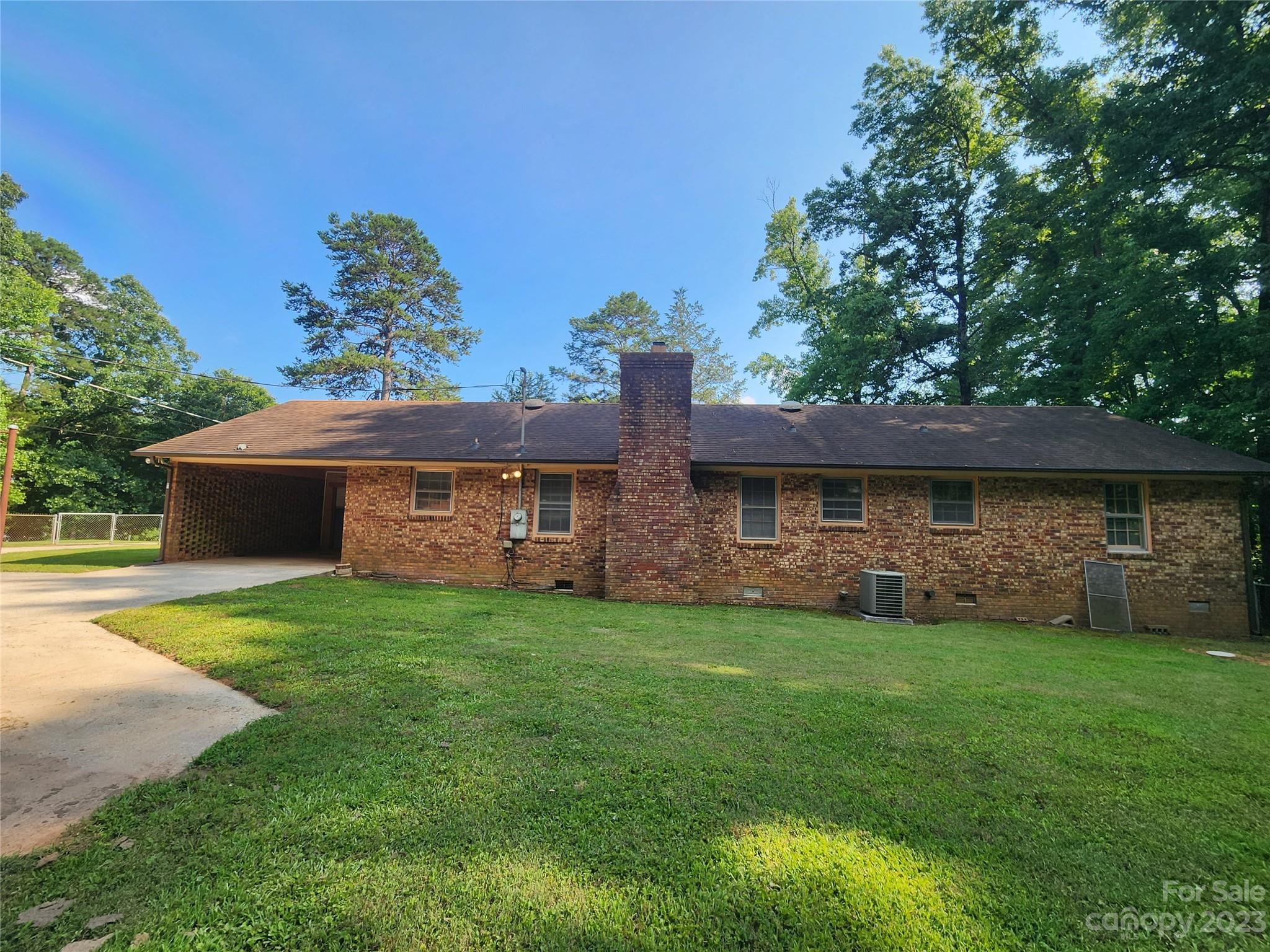 128 Devine Street Stanley, NC 28164 - Photo 30 of 36 a front view of a house with a garden
