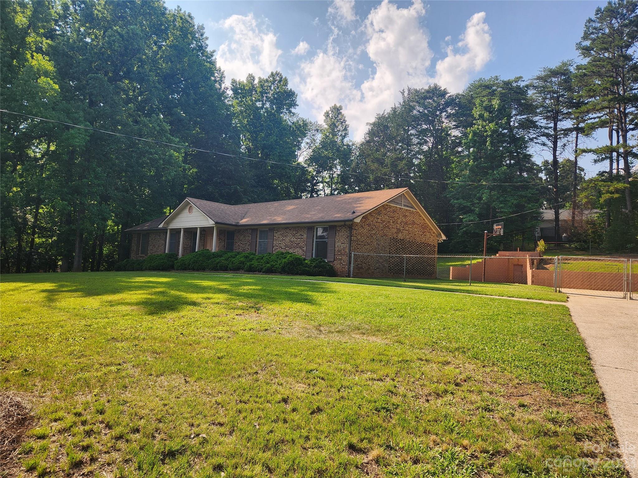 128 Devine Street Stanley, NC 28164 - Photo 36 of 36 a front view of house with yard and entertaining space