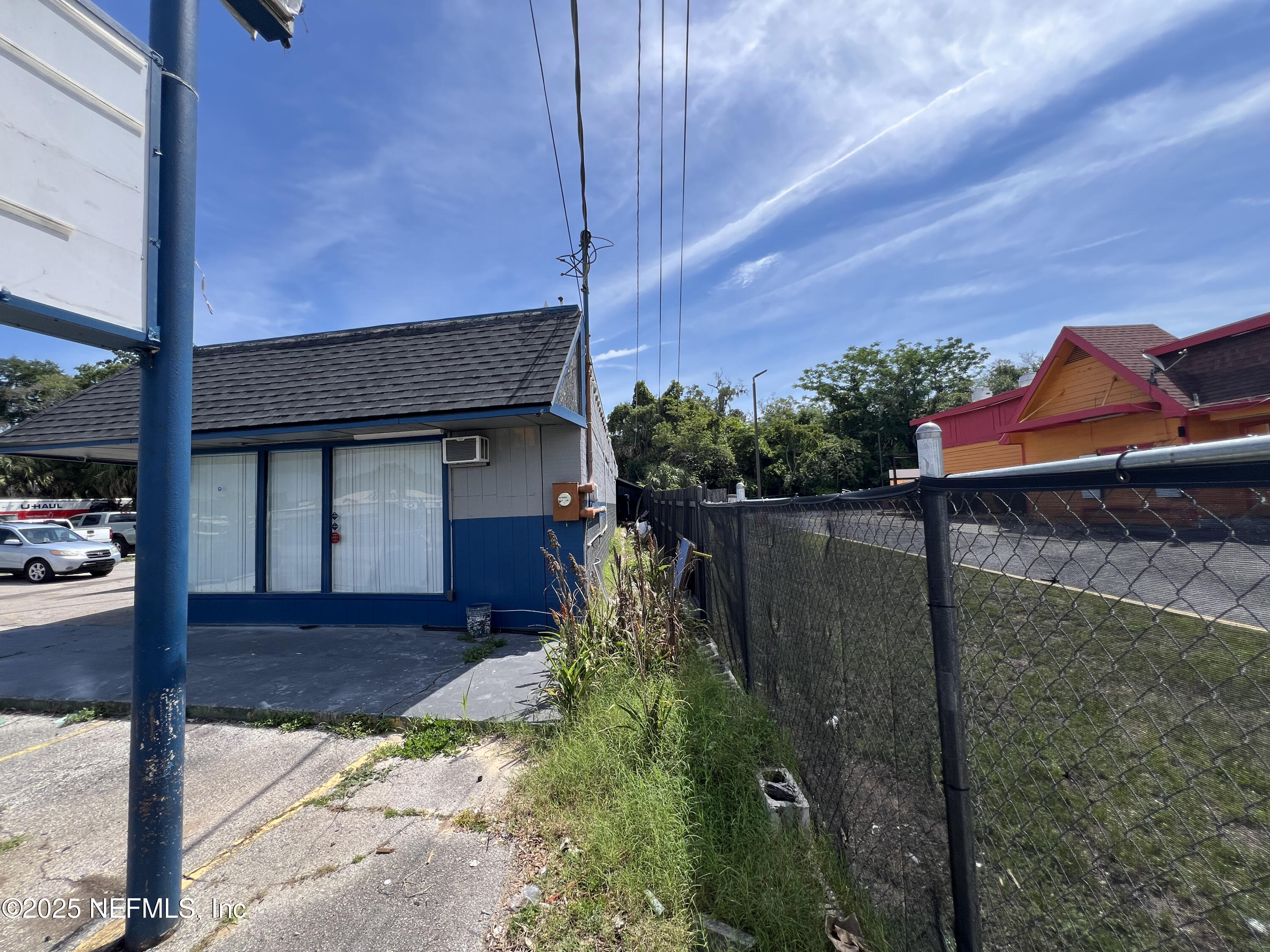 949 Arlington Road North Jacksonville, FL 32211 - Photo 13 of 25 a view of a house with a small yard and garage