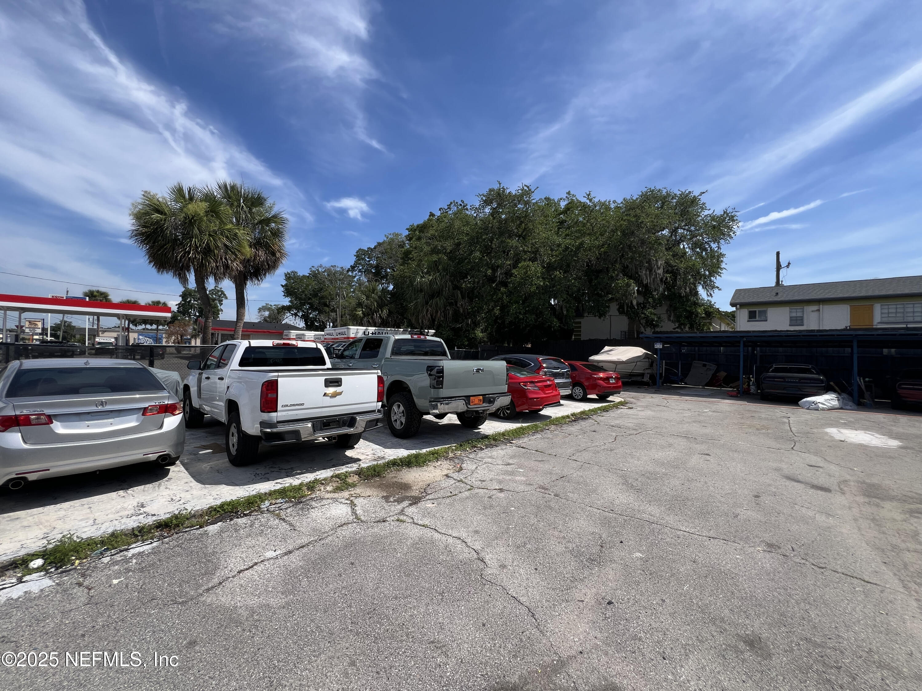 949 Arlington Road North Jacksonville, FL 32211 - Photo 16 of 25 a view of a cars park in front of a house