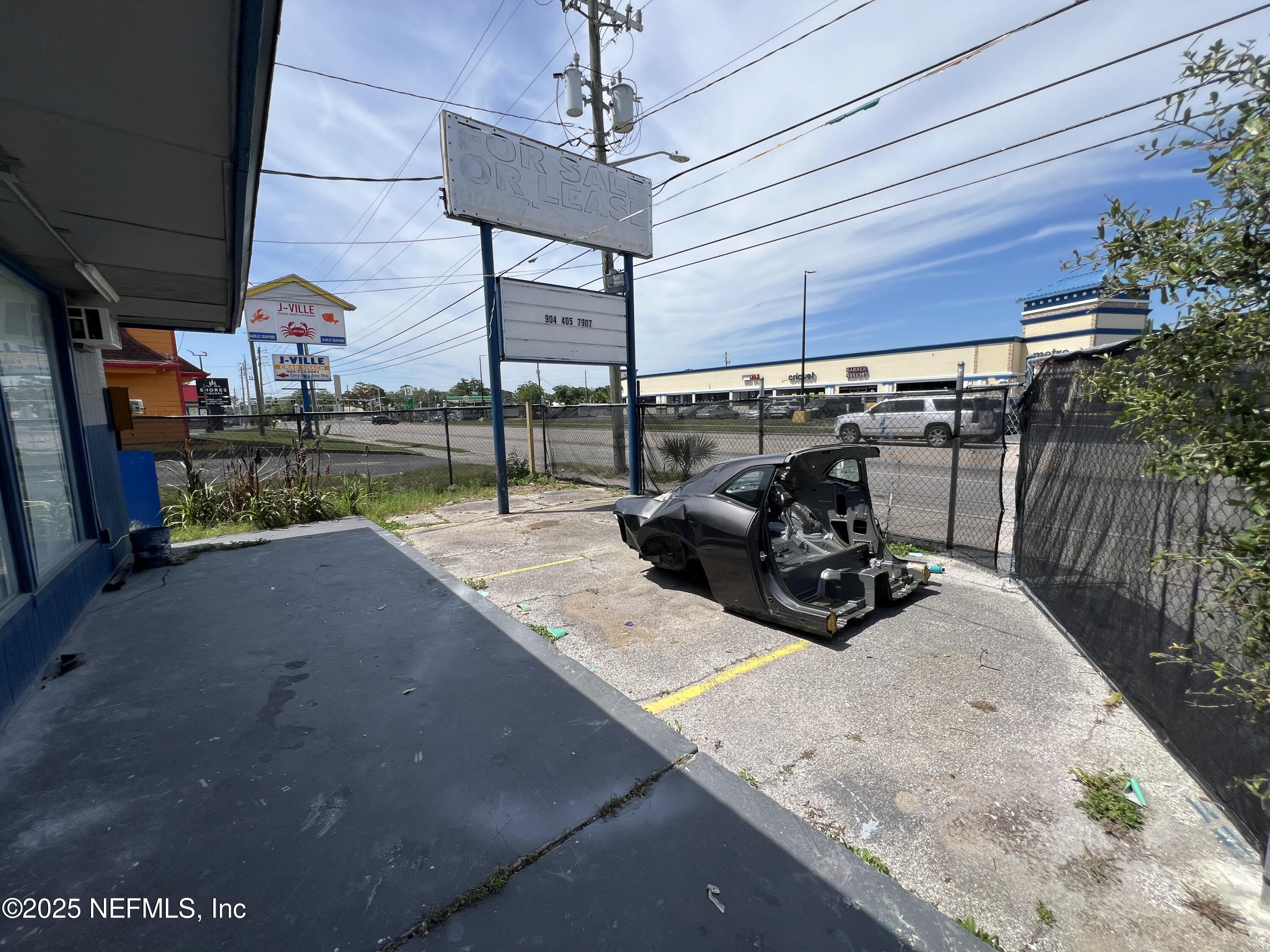 949 Arlington Road North Jacksonville, FL 32211 - Photo 17 of 25 a view of a patio with table and chairs and potted plants