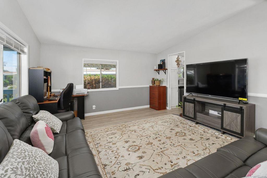 530 West Devonshire Avenue, Unit 84 Hemet, CA 92543 - Photo 11 of 36 a living room with furniture and a flat screen tv