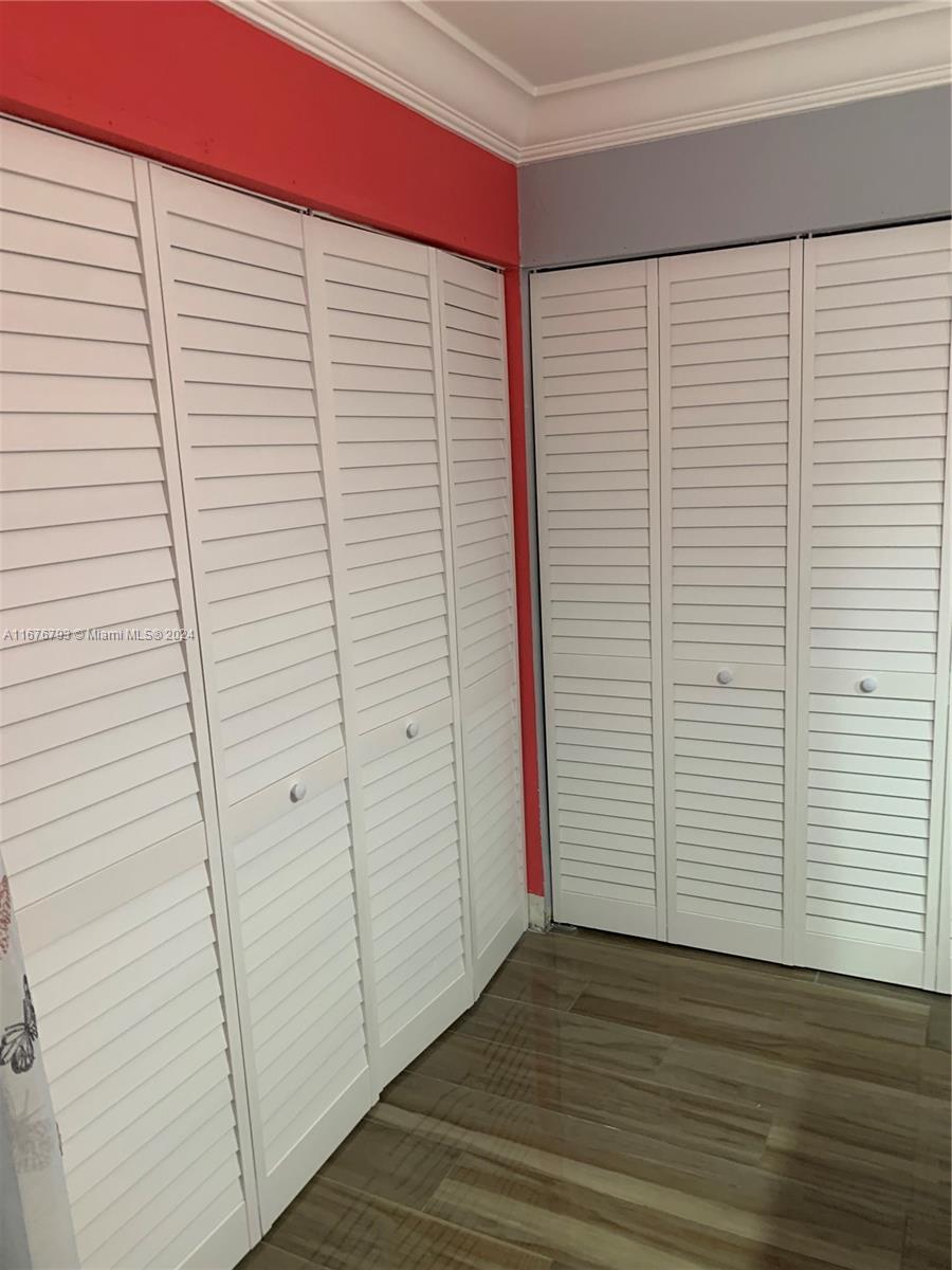 21048 Southwest 118th Place Miami, FL 33177 - Photo 16 of 26 a view of a room with wooden floor