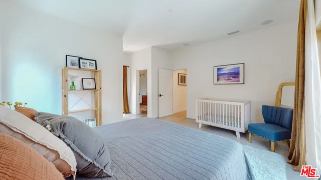 a bed room with a bed and a couch