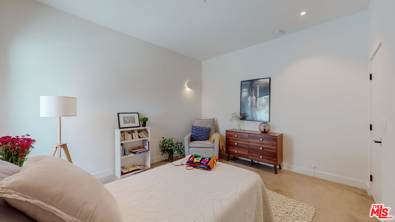 4865 Wicopee Street Los Angeles, CA 90041 - Photo 20 of 43 a bedroom with furniture and a book shelf