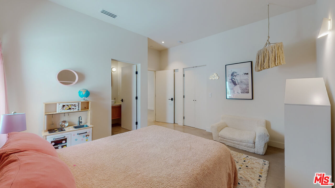 4865 Wicopee Street Los Angeles, CA 90041 - Photo 28 of 43 a bedroom with a bed and a couch