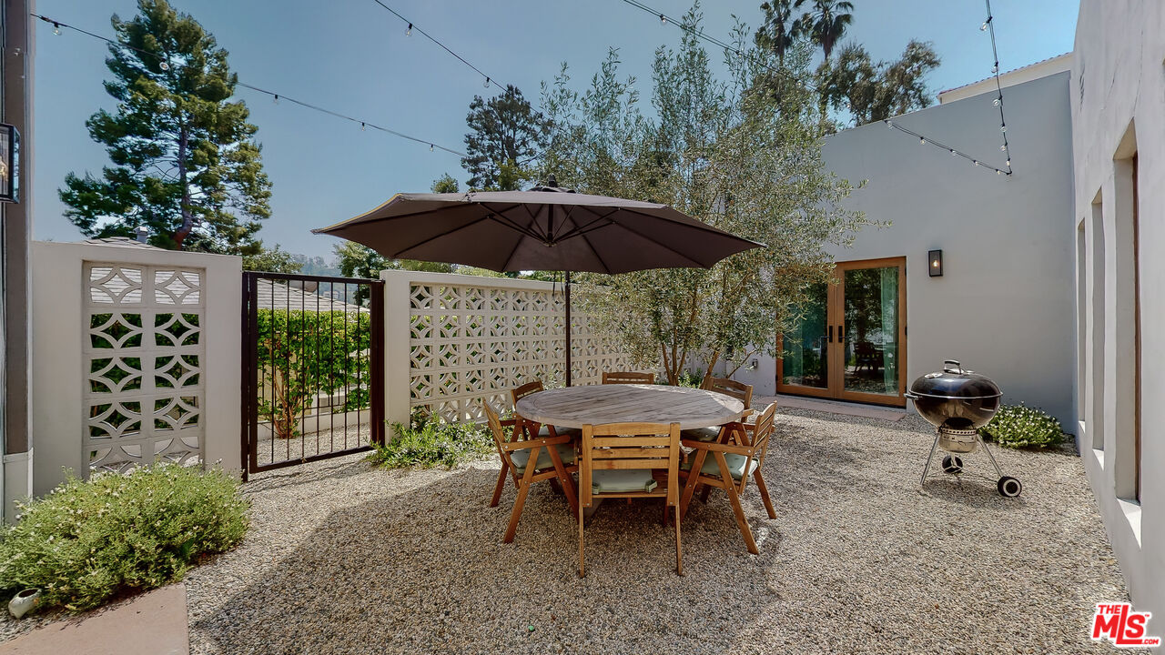 4865 Wicopee Street Los Angeles, CA 90041 - Photo 33 of 43 a backyard of a house with table and chairs