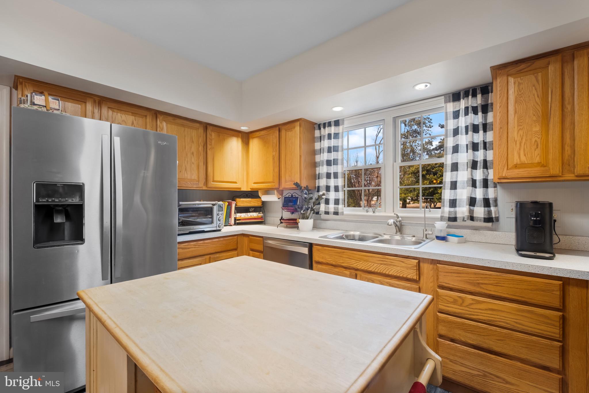 3421 Allen Road Eden, MD 21822 - Photo 27 of 56 a kitchen with stainless steel appliances granite countertop a sink refrigerator and window